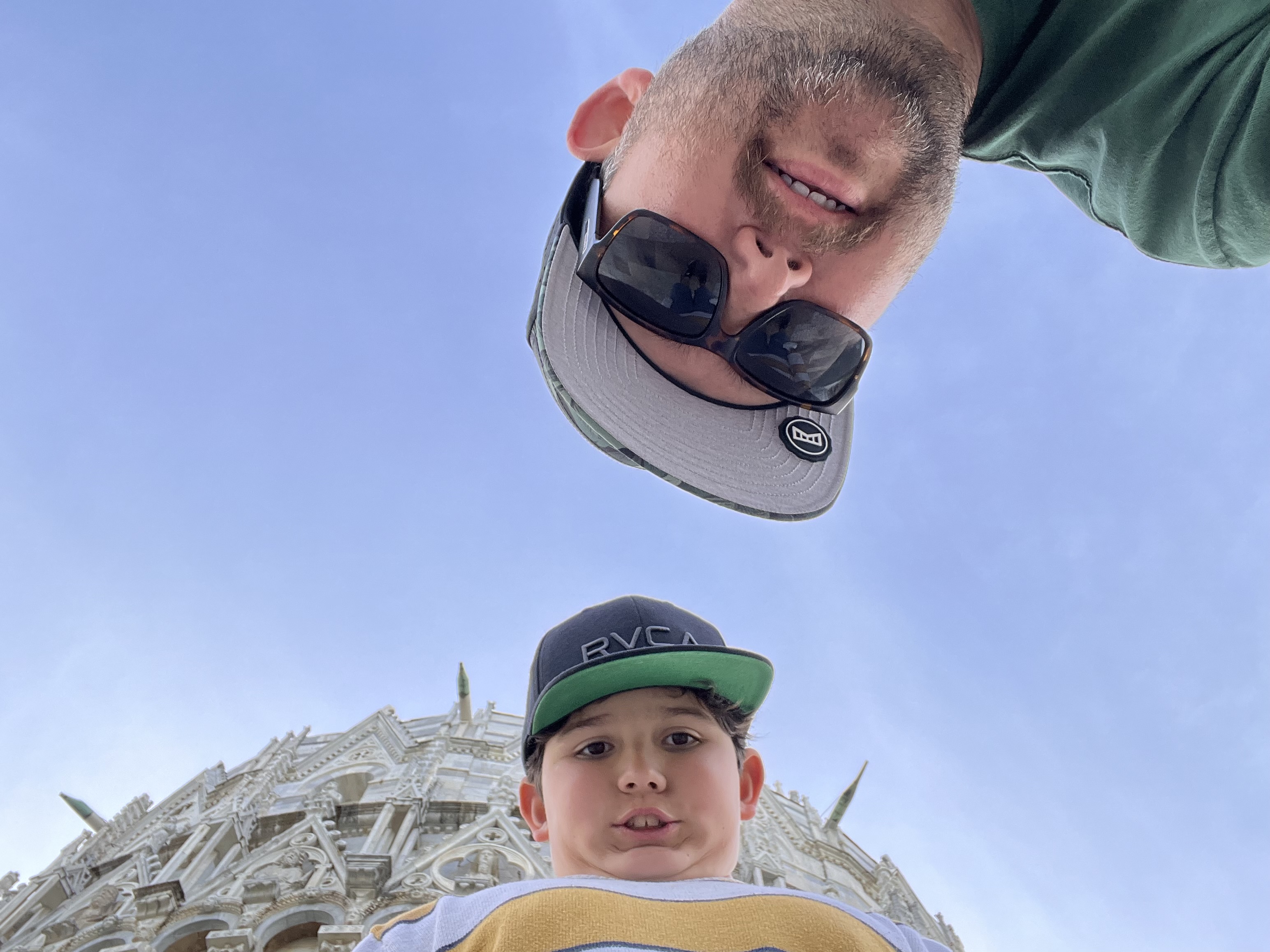 Brighton smiling in a DinoBoy hat